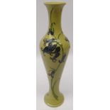 Moorcroft vase decorated in the 'Bluebell Harmony' pattern on green ground,