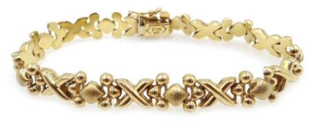 Gold cross design bracelet, London import marks 1995, approx 10.