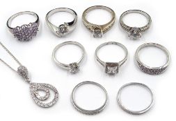 Nine silver cubic zirconia dress rings and similar pendant,
