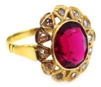 Continental gold cluster ring set with central red stone Condition Report size
