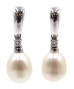 Pair of 18ct white gold pearl and diamond pendant earrings,