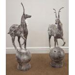 Pair cast metal garden stags on spherical mounts, figures/gate post finials,