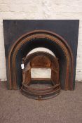 Victorian style cast iron fireplace and fire front, arched moulded aperture,