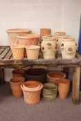 Twenty five circular garden pots and planters,