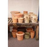 Twenty five circular garden pots and planters,