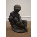 Composite stone child reading a book,