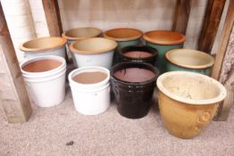 Eleven circular glazed terracotta planters