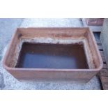 19th century D shaped cast iron trough with rolled rim, W94cm, H38cm,