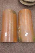 Two glazed terracotta half pipes,