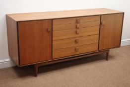 Koford Larsen for G-Plan - 1960s teak sideboard with two cupboards and five graduating drawers,