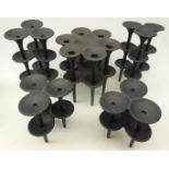 Set of ten Danish cast iron candle holders by Jens Quistgaard and two larger,