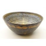 Studio pottery bowl with unglazed band, marked P.S.