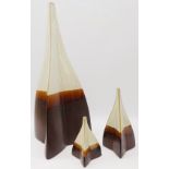 Set of three graduating ceramic vases, of triangular form with brown and white drip glaze,