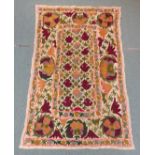 Suzani Uzbek embroidered wall hanging decorated with stylized flowers and foliage,