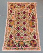 Suzani Uzbek embroidered wall hanging decorated with stylized flowers and foliage,