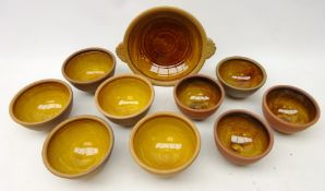 Peter and Jill Dick for Coxwold pottery, nine bowls with slip glaze and a two handled bowl,