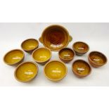 Peter and Jill Dick for Coxwold pottery, nine bowls with slip glaze and a two handled bowl,