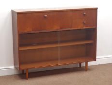 1970s teak side cabinet, fall front cupboard and two drawers above sliding glass doors, W114cm,