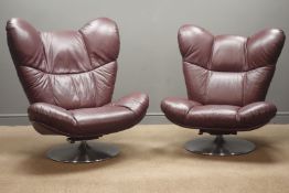Pair contemporary swivel chairs on 'Schultz Seating' tilting trumpet bases,