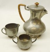 Liberty & Co 'Tudric' three piece pewter hammered tea set,