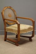 Art Deco figured walnut armchair, octagonal caned back and angular arms and supports,