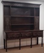 Georgian heavily carved and stained oak dresser, projecting cornice, dentil frieze,