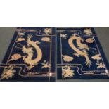 Two Chinese deep pile blue and white rugs decorated with Dragons,