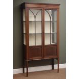 Edwardian inlaid mahogany display cabinet, two astragal glazed doors enclosing shelves,