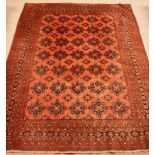 Large Persian red ground carpet, repeating border,