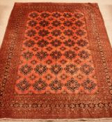 Large Persian red ground carpet, repeating border,