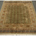 Persian Bokhara design green ground rug/wall hanging,