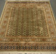 Persian Bokhara design green ground rug/wall hanging,