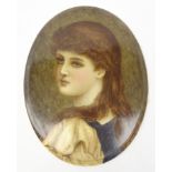 Early 20th century oval porcelain plaque hand painted with a portrait of a young girl signed A. M.