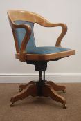 Early 20th century light oak swivel chair, with tilt action, upholstered back and seat,