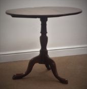 Early 19th century oak tripod table, circular tilt top, turned column with three splayed supports,