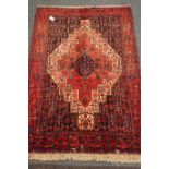 Kurdish red ground rug, central medallion,