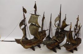 Three wooden models of three masted galleons, fully rigged with solid hulls,