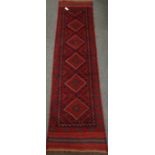 Meshwani red ground runner rug, 253cm x 63cm Condition Report <a href='//www.