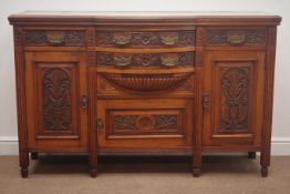 Edwardian carved walnut sideboard, bow fronted centre, four drawers three cupboards,