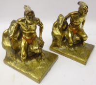Pair gilt spelter bookends in the form of a Native American seated on a rock base,