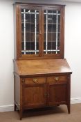 Late 19th century mahogany bureau bookcase, lead glazed doors enclosing two shelves,