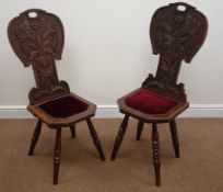 Pair Edwardian oak hall chairs, shaped backs relief carved with foliage,