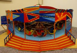 Large brightly painted electrically operated scratch built wooden and metal fairground roundabout