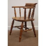 20th century oak tub shaped captains chair, turned supports and stretchers,