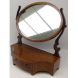 Inlaid mahogany oval swing toilet mirror with curving supports,