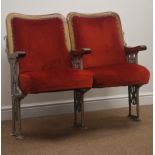 Pair of Theatre seats, pierced cast iron frame with wooden arm rests and hinged upholstered seat,