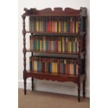 19th century mahogany four tier bookcase, containing novels by Irwin Shaw, Gerald Hanley,