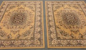 Two Persian style beige ground rug, central medallion, repeating border,
