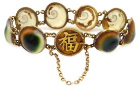 Chinese 18ct gold mounted operculum (evil eye) panel bracelet,