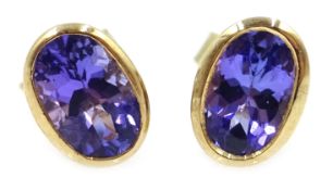 Pair of 9ct gold (tested) oval tanzanite stud earrings,